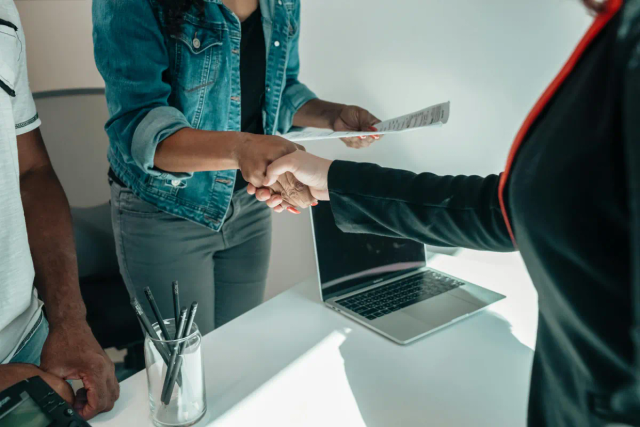 Interviewer and applicant shaking hands